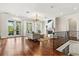 Bright living room boasts hardwood floors, french doors and a fireplace at 8542 Eden Park Rd, Orlando, FL 32810