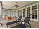 Inviting porch area with comfortable lounge chairs overlooking serene views at 8542 Eden Park Rd, Orlando, FL 32810