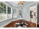 Sitting room with wooden floor, windows, and a view at 8542 Eden Park Rd, Orlando, FL 32810