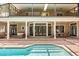 This pool is a backyard oasis, visible from the balcony and offering views of outdoor seating and lounge areas at 8800 Torey Pines Ter, Orlando, FL 32819