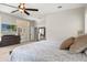 Bedroom featuring a bed, dresser, and sliding glass doors to the patio at 8800 Torey Pines Ter, Orlando, FL 32819