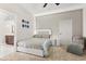 This comfortable bedroom is carpeted and offers a ceiling fan and lighted headboard at 8800 Torey Pines Ter, Orlando, FL 32819