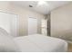 Bedroom with carpet flooring, closet, and access to the staircase at 8800 Torey Pines Ter, Orlando, FL 32819