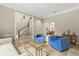 Elegant living room with neutral decor, marble floors, and open access to foyer and other living spaces at 8800 Torey Pines Ter, Orlando, FL 32819