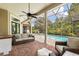 Enjoy the outdoor pool area featuring lounge seating, brick pavers, and full enclosure for year-round comfort and relaxation at 8800 Torey Pines Ter, Orlando, FL 32819