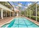 The pool features brick pavers and a full enclosure for outdoor enjoyment and easy maintenance at 8800 Torey Pines Ter, Orlando, FL 32819