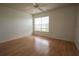 Bright bedroom featuring a ceiling fan, natural light, and wood-look floors, perfect for comfort at 9053 Lee Vista Blvd # 1404, Orlando, FL 32829