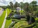 An aerial view of the Vista Lakes neighborhood entrance with lush landscaping and fountain at 9053 Lee Vista Blvd # 1404, Orlando, FL 32829
