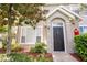 Inviting front entrance with a black door and well-maintained landscaping, creating curb appeal at 9053 Lee Vista Blvd # 1404, Orlando, FL 32829