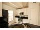 Well-equipped kitchen with black countertops, stainless steel appliances, and white cabinetry at 9053 Lee Vista Blvd # 1404, Orlando, FL 32829