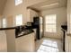 Functional kitchen featuring stainless steel appliances, white cabinets, and a breakfast bar at 9053 Lee Vista Blvd # 1404, Orlando, FL 32829