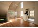Open living area with hardwood floors and large windows provide natural light at 9053 Lee Vista Blvd # 1404, Orlando, FL 32829