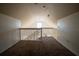 Spacious loft area with railing overlooking the living space, offering versatility at 9053 Lee Vista Blvd # 1404, Orlando, FL 32829