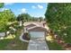 Charming home with stone accents, a two-car garage, and mature trees in a well-kept neighborhood at 10519 Wyndcliff Dr, Orlando, FL 32817