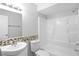 Clean bathroom with shower-tub combo, updated vanity, and decorative tile backsplash at 10519 Wyndcliff Dr, Orlando, FL 32817