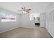 Bedroom featuring wood-look tile, ceiling fan and ensuite bathroom at 10519 Wyndcliff Dr, Orlando, FL 32817
