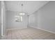 Dining area features tiled floors, a chandelier, and neutral paint at 10519 Wyndcliff Dr, Orlando, FL 32817