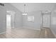 Open dining area with tiled floors and a view to the front entry at 10519 Wyndcliff Dr, Orlando, FL 32817