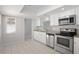 Bright kitchen features white cabinets, stainless steel appliances, and granite countertops at 10519 Wyndcliff Dr, Orlando, FL 32817