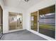 Enclosed patio with sliding doors leading to interior living spaces and backyard views at 10519 Wyndcliff Dr, Orlando, FL 32817