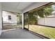 Enclosed patio offers views of the backyard with plenty of room for outdoor entertaining at 10519 Wyndcliff Dr, Orlando, FL 32817