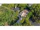 Aerial view of a home with lush landscaping, a large front yard, and a tile roof at 1150 Via Salerno, Winter Park, FL 32789