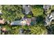 Aerial view of a property with mature trees, tile roof, and swimming pool at 1150 Via Salerno, Winter Park, FL 32789