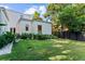 Backyard with lush green grass, privacy fence, and manicured landscaping at 1150 Via Salerno, Winter Park, FL 32789