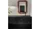 Elegant bathroom featuring a unique black marble sink and decorative mirror at 1150 Via Salerno, Winter Park, FL 32789