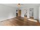 Open and bright bedroom with hardwood floors, white walls, and doorways to other rooms at 1150 Via Salerno, Winter Park, FL 32789