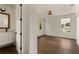 Bright bedroom with hardwood floors and two windows providing natural light at 1150 Via Salerno, Winter Park, FL 32789