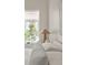 Bright bedroom features a large window, natural light, and views of the backyard at 1150 Via Salerno, Winter Park, FL 32789