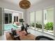 Bright exercise room with fitness equipment and access to a pool view and outdoor space at 1150 Via Salerno, Winter Park, FL 32789