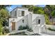 Striking contemporary home with a white exterior, multi-level roofline, and professionally landscaped front yard at 1150 Via Salerno, Winter Park, FL 32789