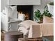 Close up of fireplace, white couch and green plants at 1150 Via Salerno, Winter Park, FL 32789