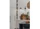 Bright kitchen features white cabinets and island with stone countertop and wooden accents at 1150 Via Salerno, Winter Park, FL 32789