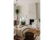 Bright living room with a white fireplace, neutral furniture, and large windows that flood the space with natural light at 1150 Via Salerno, Winter Park, FL 32789