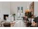 Cozy living room with modern fireplace, comfortable seating, and stylish decor with natural light at 1150 Via Salerno, Winter Park, FL 32789