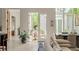 Bright and open living room with backyard access and views of the dining area at 1150 Via Salerno, Winter Park, FL 32789