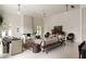 Open-concept living room with fireplace, neutral tones, and large windows at 1150 Via Salerno, Winter Park, FL 32789
