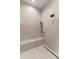 This modern shower showcases textured wall tile, a sleek shower system, and an integrated bench at 1150 Via Salerno, Winter Park, FL 32789