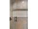 Close-up of tiled shower with glass door and decorative tile accent at 1150 Via Salerno, Winter Park, FL 32789