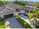 Spacious home from above with a sparkling pool, spa, and private backyard oasis at 11754 Waterstone Loop Dr, Windermere, FL 34786