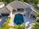 Stunning aerial view of a property showcasing a large pool, spa, and meticulously landscaped grounds at 11754 Waterstone Loop Dr, Windermere, FL 34786