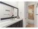 This bathroom features a vanity with solid surface countertops and a separate room for the shower and tub at 11754 Waterstone Loop Dr, Windermere, FL 34786