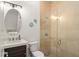 The bathroom features a glass shower, neutral tile, and plenty of natural light at 11754 Waterstone Loop Dr, Windermere, FL 34786