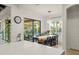 Bright dining area with a view of the outdoor patio and an elegant lighting fixture at 11754 Waterstone Loop Dr, Windermere, FL 34786