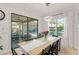 Dining area with a view of the backyard, outdoor patio, and elegant table setting at 11754 Waterstone Loop Dr, Windermere, FL 34786