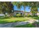 Beautiful home featuring well-manicured lawns, mature trees, and tasteful landscaping at 11754 Waterstone Loop Dr, Windermere, FL 34786