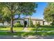 Charming home with a meticulously maintained front yard and mature trees at 11754 Waterstone Loop Dr, Windermere, FL 34786